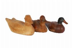 THREE CARVED WOOD DECOY DUCKS