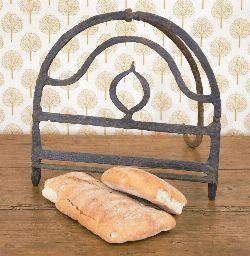 19TH-CENTURY IRON BREAD HARDENING STAND WITH FLAME DECORATION
