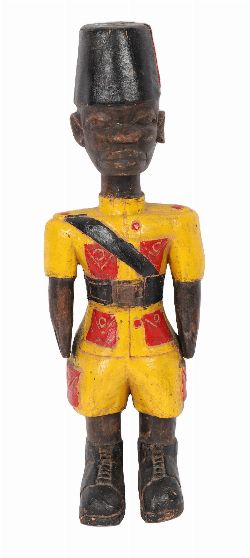 MID-20TH-CENTURY WEST AFRICAN CARVED AND PAINTED COLONIAL SOLDIER FIGURE