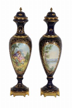 PAIR OF 19TH-CENTURY ORMOLU-MOUNTED SÃˆVRES PAINTED URNS