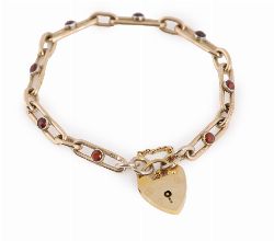 GOLD AND GARNET BRACELET WITH GOLD PADLOCK