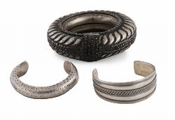 TWO SILVER BANGLES AND NORTH AFRICAN ANKLE RING

