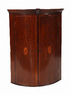 GEORGE III MAHOGANY BOW-FRONTED HANGING CORNER CABINET