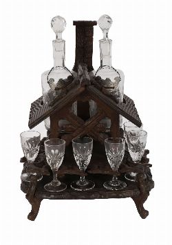 BLACK FOREST CARVED HOUSE-FORM DECANTER SET
