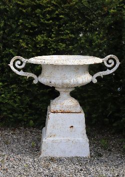 PAIR 19TH-CENTURY LARGE WHITE-PAINTED CAST IRON URNS ON PLINTHS