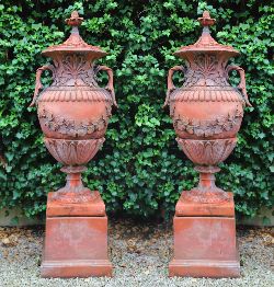 PAIR OF MONUMENTAL TERRACOTTA GARDEN URNS ON PEDESTALS