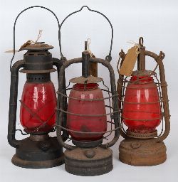 THREE ANTIQUE OIL LAMPS WITH RUBY SHADES