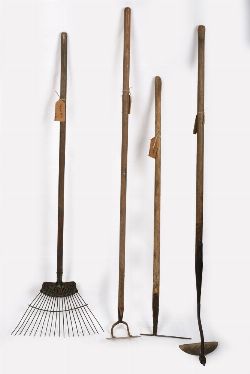 TWO ANTIQUE HOES, A RAKE AND A PICK
