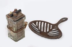 ANTIQUE GRIDDLE AND VINTAGE BATTERY