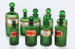 COLLECTION OF GREEN GLASS RIBBED APOTHECARY BOTTLES