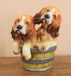 GLAZED POTTERY GROUP: TWO DOGS IN A BARREL