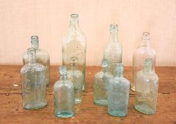 COLLECTION OF 10 GLASS WHISKEY BOTTLES