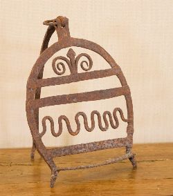 19TH-CENTURY IRON BREAD HARDENER