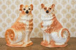 PAIR OF STAFFORDSHIRE SEAT DOGS