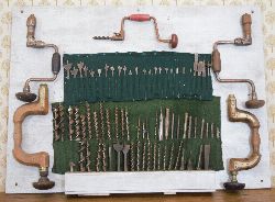 COLLECTION OF CARPENTER'S TOOLS MOUNTED ON PLAQUE