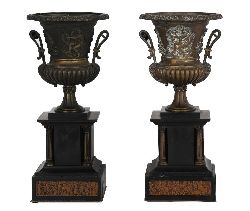 PAIR OF NEOCLASSICAL STYLE BRONZE URNS ON PLINTHS