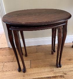 EARLY 20TH-CENTURY NEST OF TWO MAHOGANY TABLES