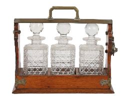 VICTORIAN OAK & BRASS-BOUND TANTALUS SET, LATE 19TH CENTURY
