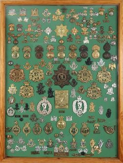 FRAMED COLLECTION OF REGIMENTAL BADGES