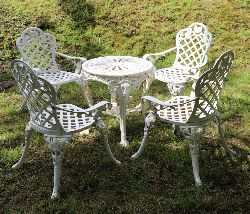CAST IRON GARDEN TABLE AND FOUR CHAIRS