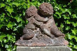 SANDSTONE GROUP OF EMBRACING CHERUBS