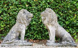 PAIR 19TH-CENTURY STONE SCULPTURES OF SEATED LIONS