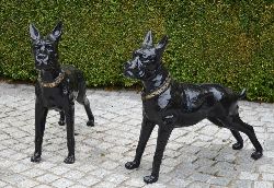 PAIR OF CAST IRON MODELS OF BOXER DOGS