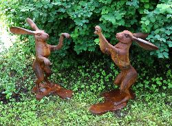 PAIR OF CAST IRON BOXING HARES