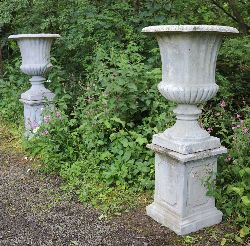 PAIR OF LARGE ITALIANATE STONE URNS
