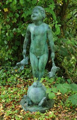CAST BRONZE FIGURE OF A JOYFUL CHILD WITH FROGS