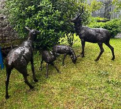 GROUP OF FOUR BRONZE DEER GARDEN SCULPTURES