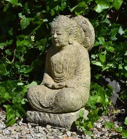 MOULDED STONE SCULPTURE OF A SEATED GODDESS