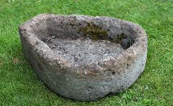 UNUSUAL 19TH-CENTURY PEAR-SHAPED STONE TROUGH