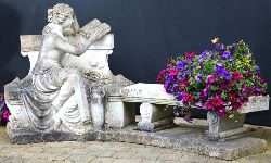 19TH-CENTURY LIFE-SIZE MARBLE SCULPTURE OF ELEGANT LADY SEATED ON GARDEN BENCH READING BOOK