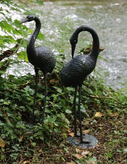PAIR OF CAST IRON GARDEN SCULPTURES - CRANES