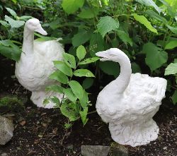 CAST IRON GARDEN SCULPTURES OF A GOOSE AND GANDER