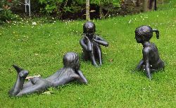 GROUP OF THREE BRONZE GARDEN SCULPTURES - THE STORYTELLERS