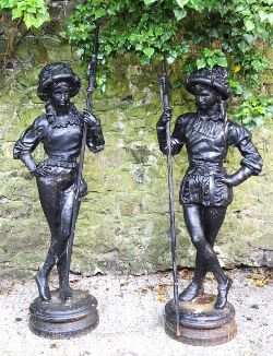 PAIR OF CAST IRON FIGURES OF RENAISSANCE-STYLE SENTINELS