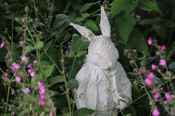 PAINTED COMPOSITE FIGURE OF A RABBIT IN A SUIT