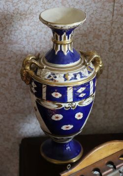 19TH-CENTURY CONTINENTAL PORCELAIN VASE WITH RAM'S HEAD HANDLES