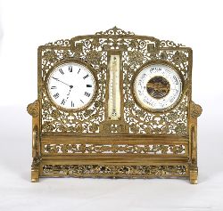 EDWARDIAN BRASS DESKTOP COMPENDIUM WITH CLOCK, THERMOMETER, AND BAROMETER