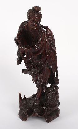 CHINESE CARVED HARDWOOD FIGURE OF AN IMMORTAL