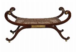 REGENCY STYLE MAHOGANY AND PARCEL-GILT BATEAU-SHAPED STOOL