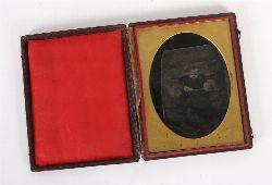19TH-CENTURY AMBROTYPE OF A CHILD IN A VELVET-LINED CASE