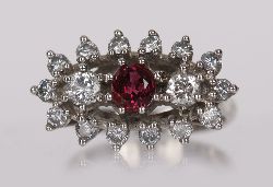 18 CARAT WHITE GOLD RUBY AND DIAMOND CLUSTER RING