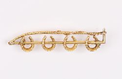18CT GOLD HORSESHOE AND WHIP BROOCH