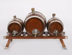 19TH-CENTURY TRIO OF OAK AND BRASS-BOUNDED PORT BARRELS ON STAND