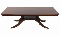 WITHDRAWN REGENCY STYLE MAHOGANY PEDESTAL COFFEE TABLE ON QUADRUPLE SABRE LEGS