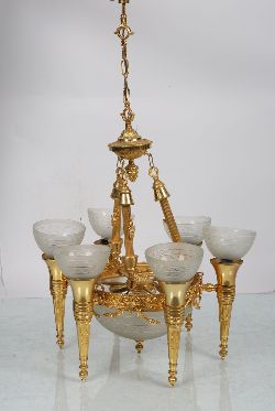 SIX-ARM GILT CHANDELIER WITH FROSTED GLASS SHADES