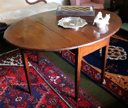 GEORGE III MAHOGANY OVAL DINING TABLE